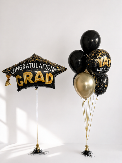 Graduation Balloon Set with one large graduation balloon, four latex balloons, and two themed foil balloons for graduation decor in Manhattan