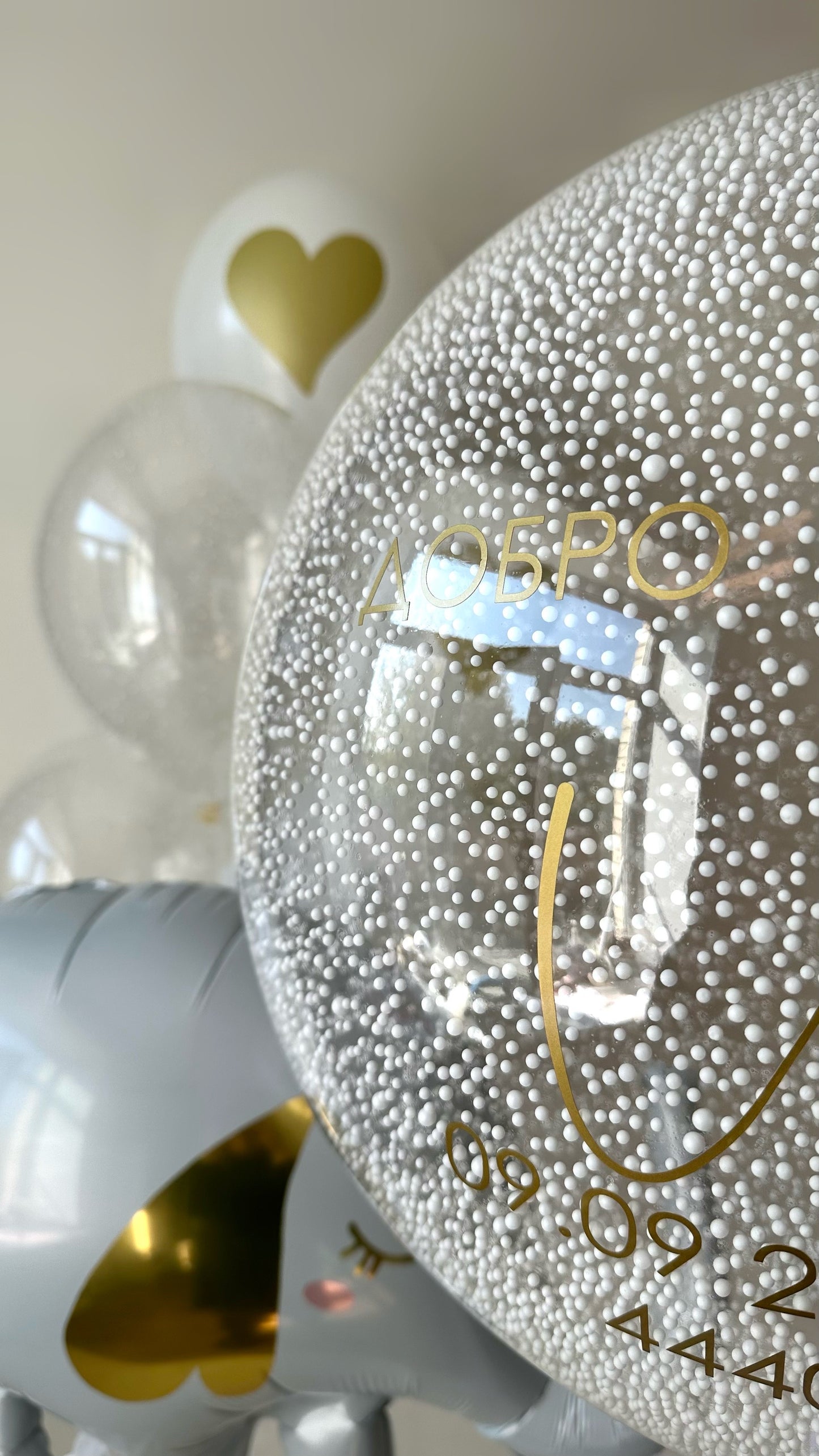 Detail of personalized foam bead bubble balloon with elegant baby styling in Manhattan