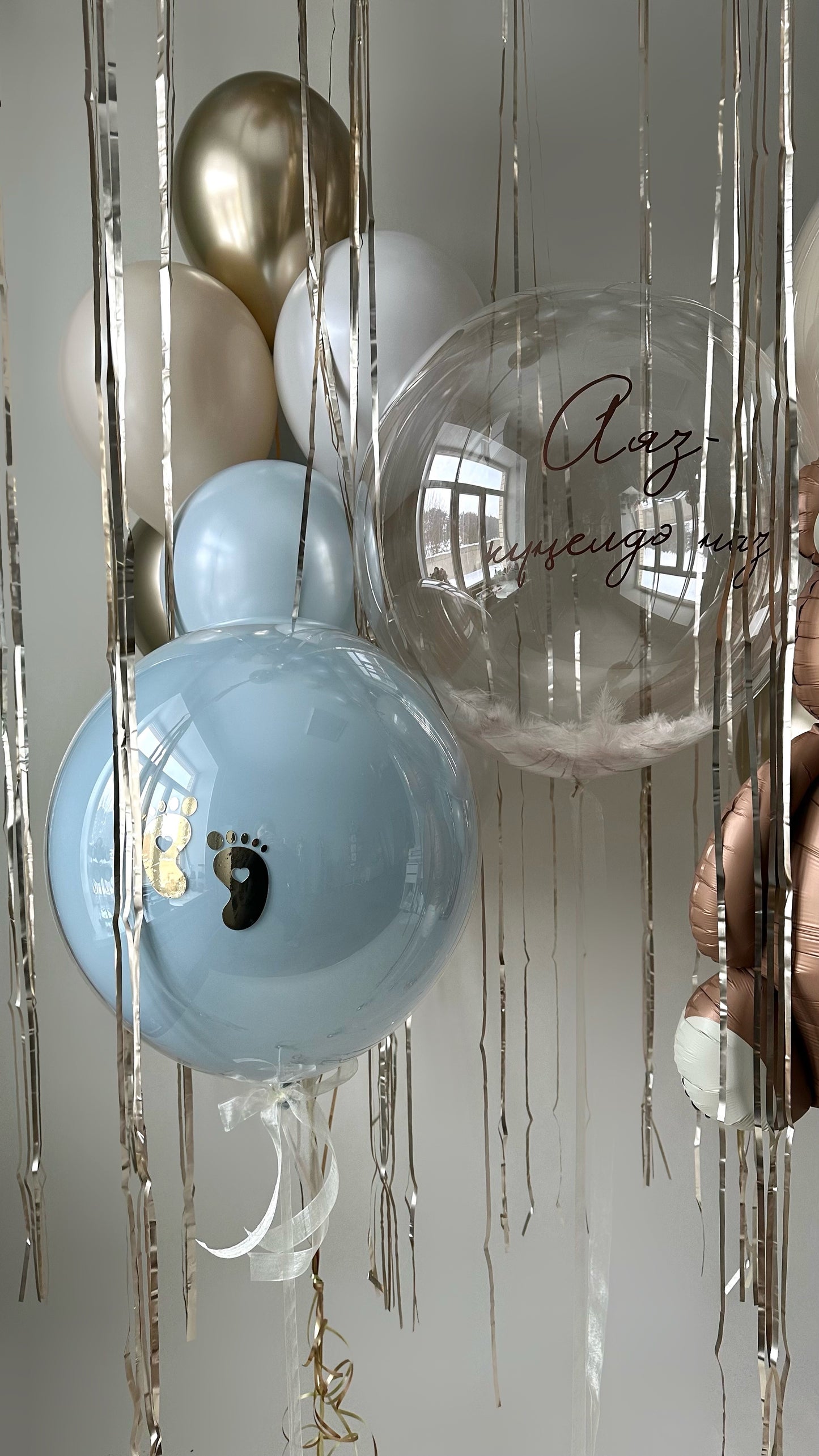 Blue silhouette bubble balloon styled for newborn welcome decor in Manhattan