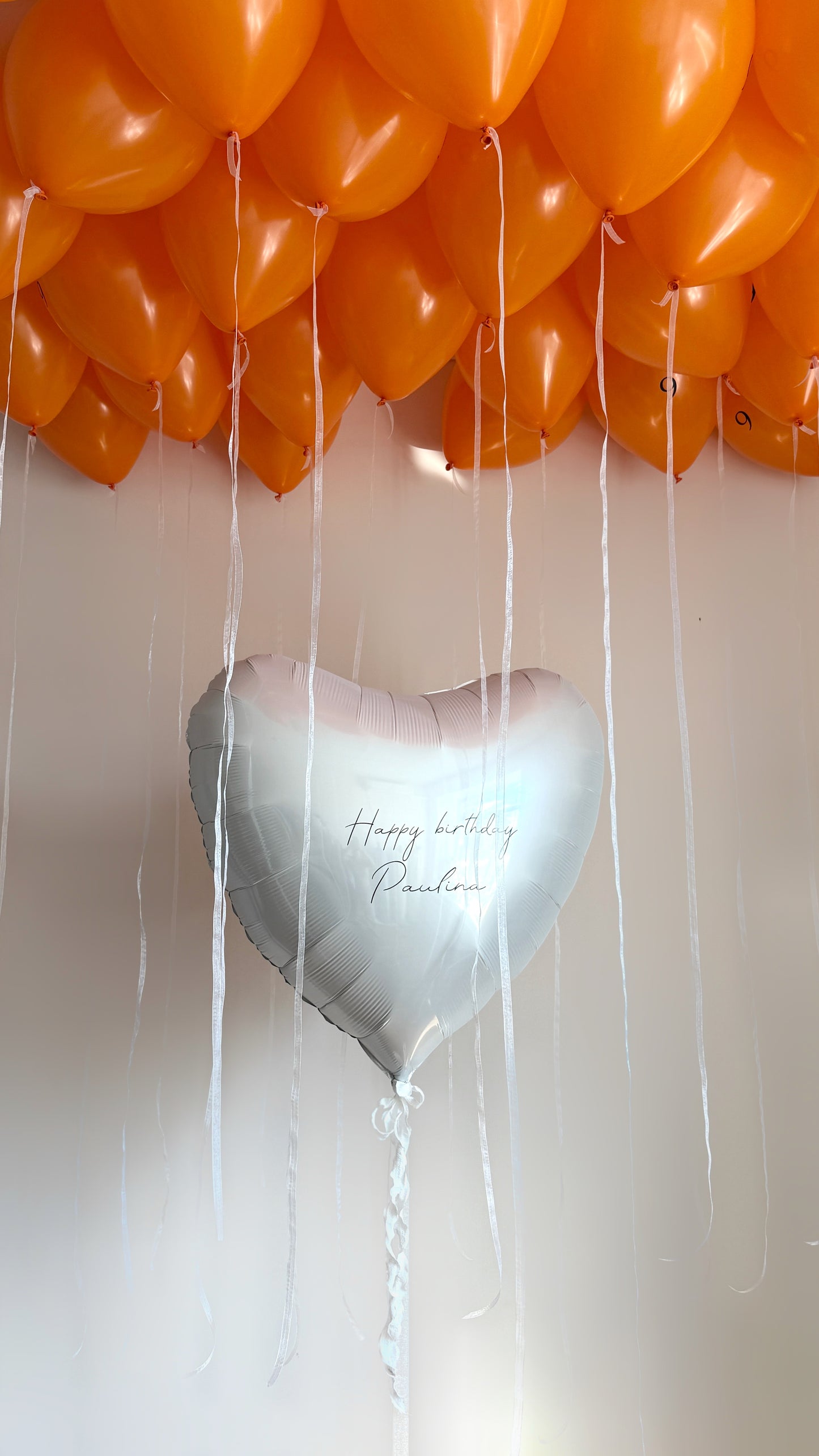 Juicy birthday balloon set with custom heart balloon and orange ceiling balloons for celebration decor in New York
