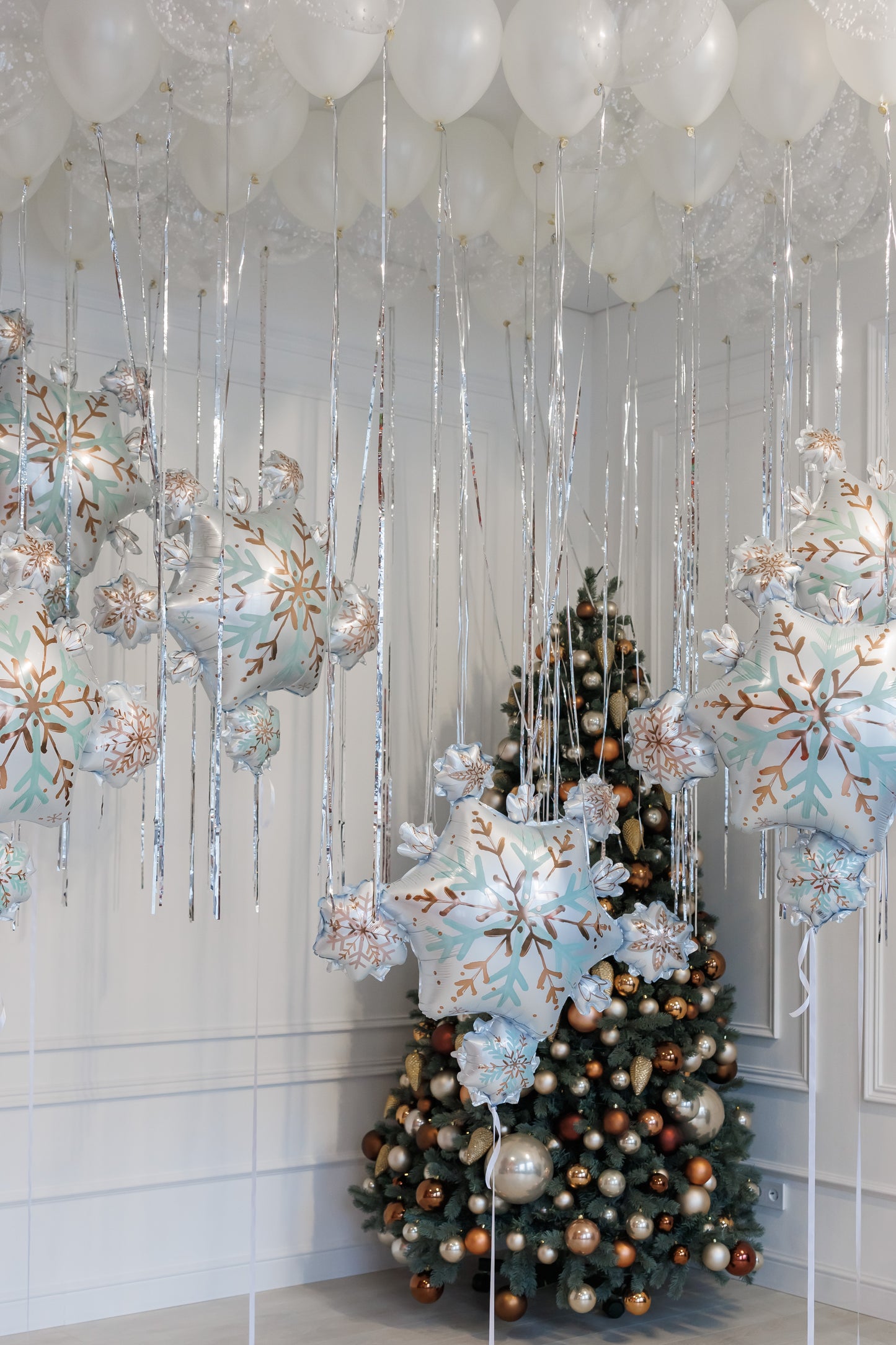 Let it snow balloon set with white ceiling balloons and snowflake decor for holiday styling in New York