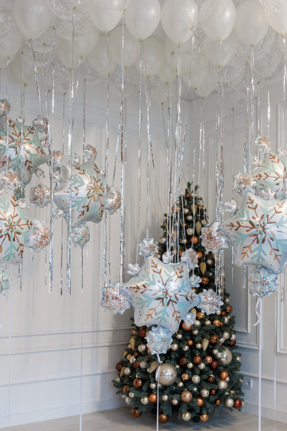 Let it snow balloon set with white ceiling balloons and snowflake decor for holiday styling in New York