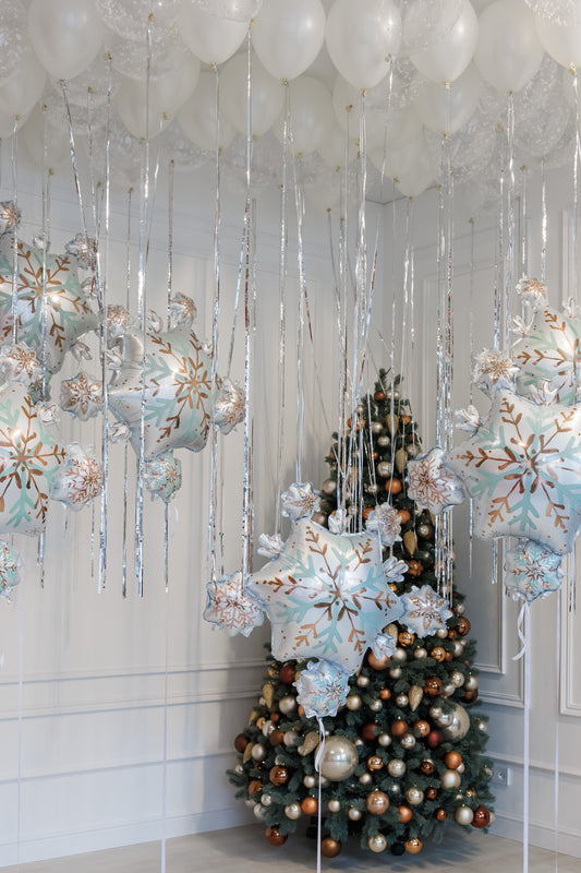 Let it snow balloon set with white ceiling balloons and snowflake decor for holiday styling in New York