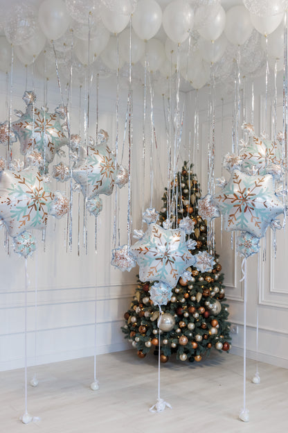 Winter balloon decor with snowflake balloons and festive white styling for holiday events in Brooklyn