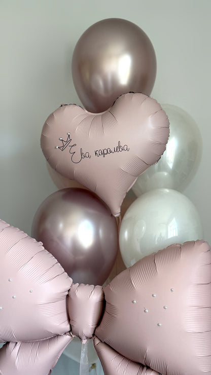 Girls birthday balloon decor with heart balloon, pink bow balloon, and custom sign in Manhattan