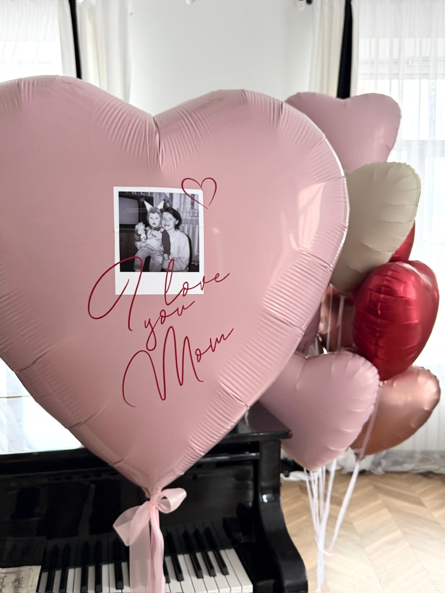 Love You Mom balloon set with giant personalized heart balloon, photo detail, and pink heart balloons for celebration decor in Queens