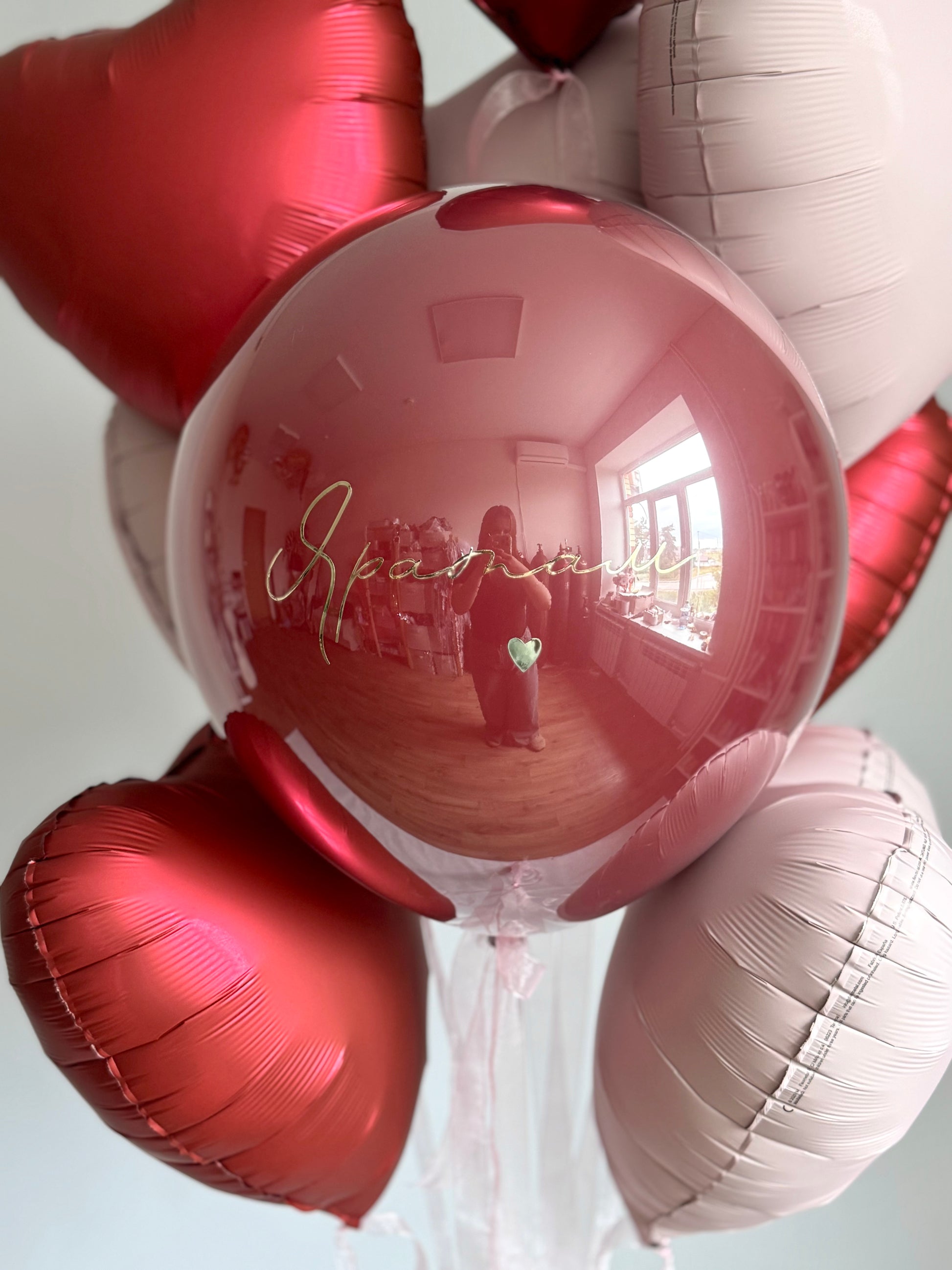 Close-up of personalized bubble balloon with layered heart balloons for romantic decor in Manhattan
