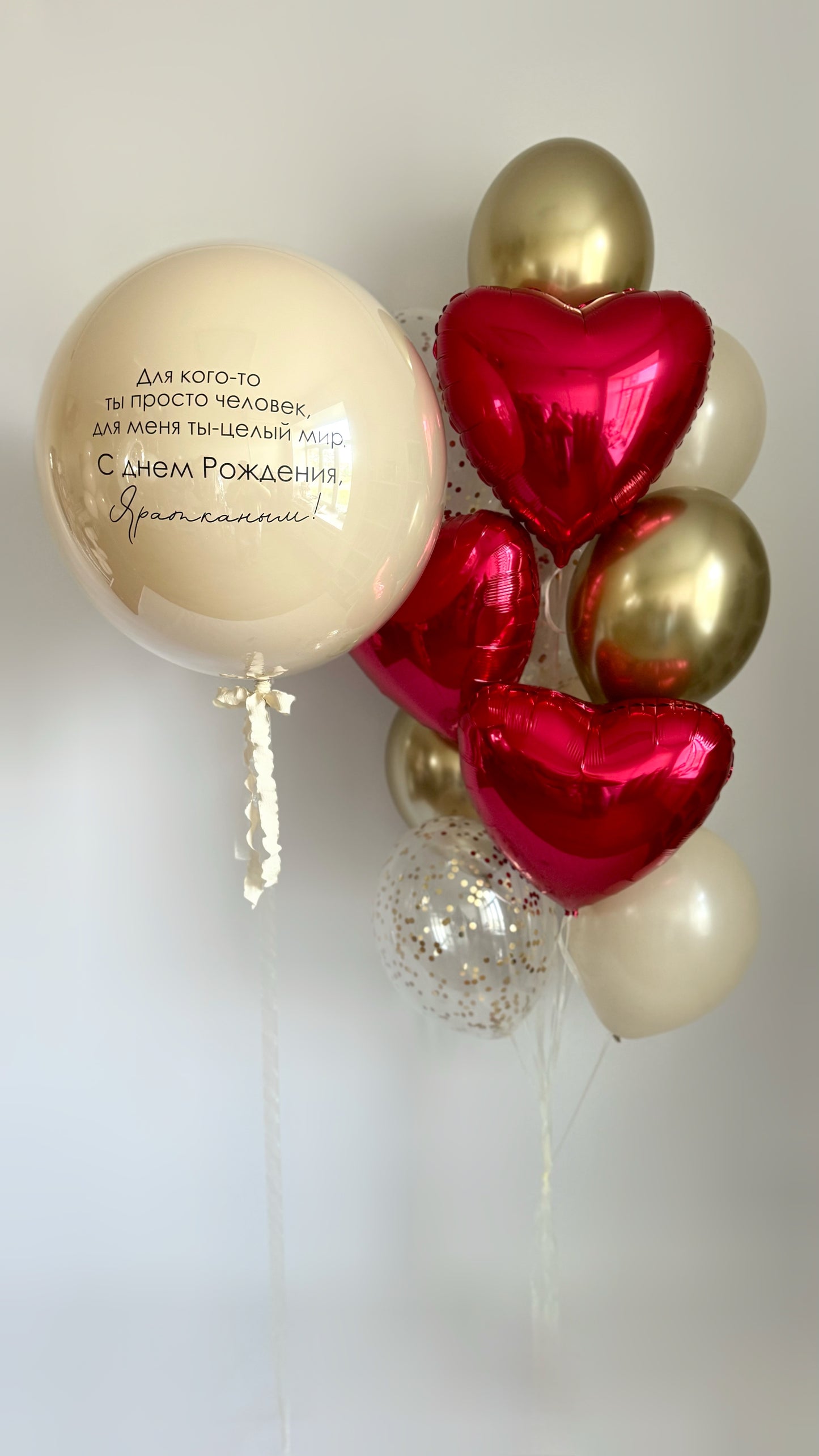 Romantic bubble balloon set with red heart balloons and gold accents for celebration decor in New York