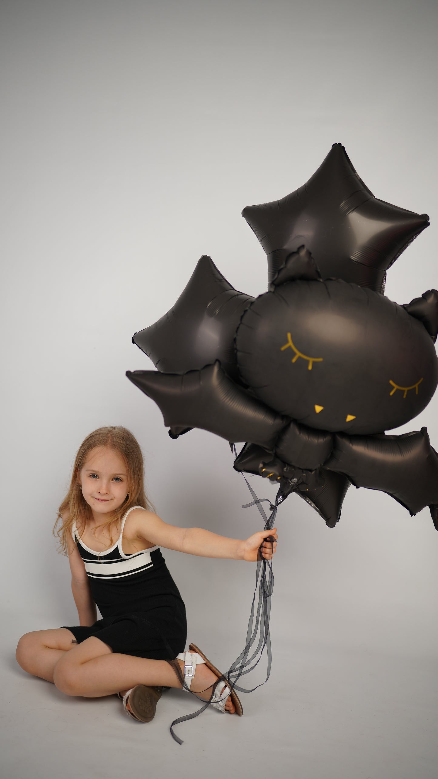 Midnight balloon set with giant bat balloon and black star balloons for Halloween party decor in New York