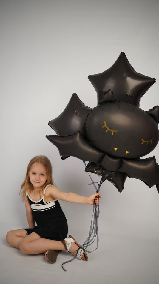 Midnight balloon set with giant bat balloon and black star balloons for Halloween party decor in New York