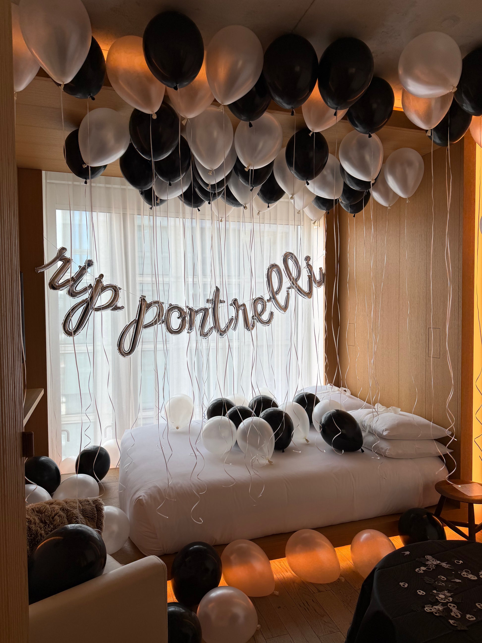 Midnight Pearl Room Decor Set with black and pearl white ceiling balloons, floor balloons, and a custom foil wall banner