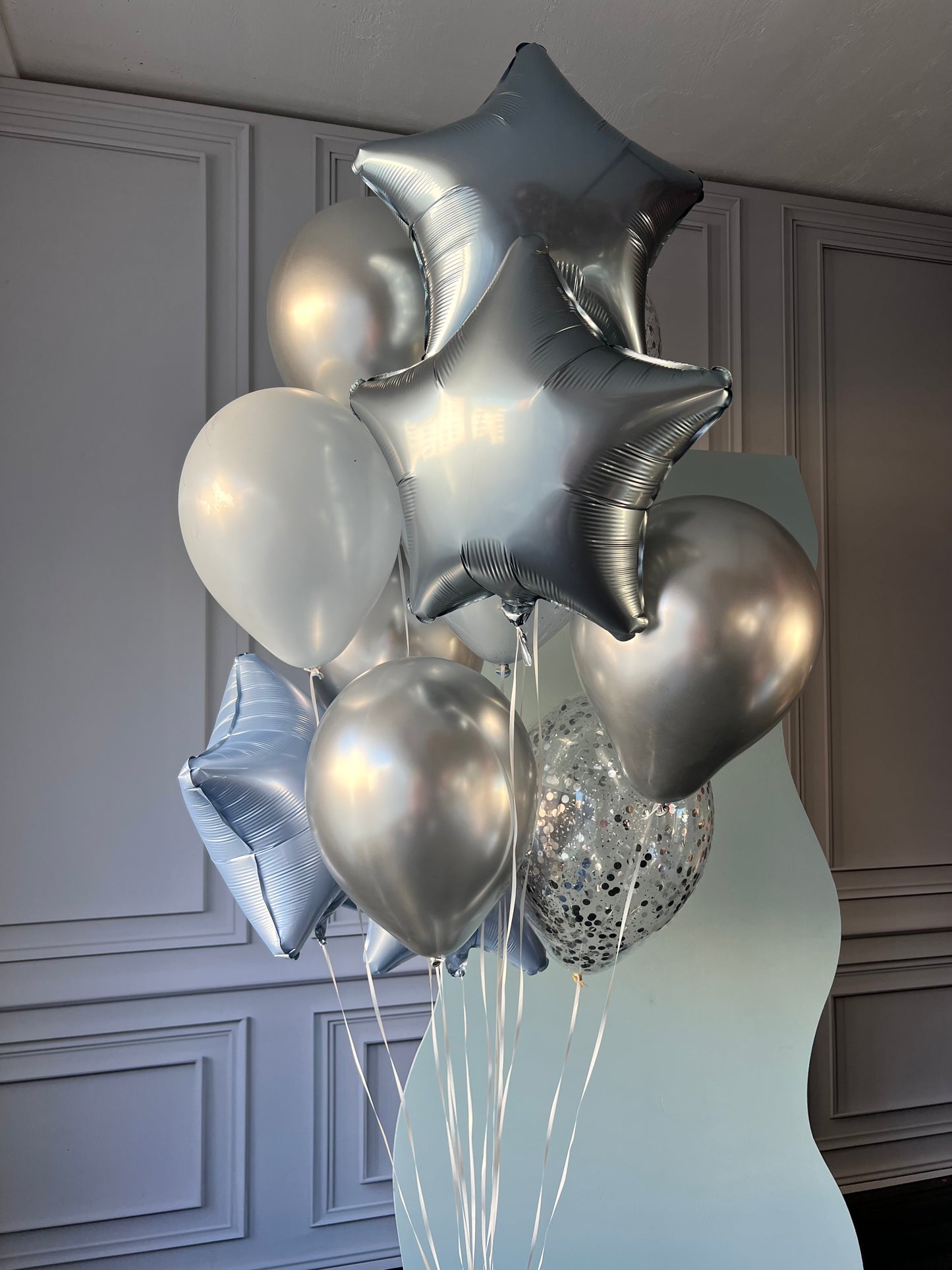 Mint star balloon set with silver star balloons and pastel birthday decor in New York