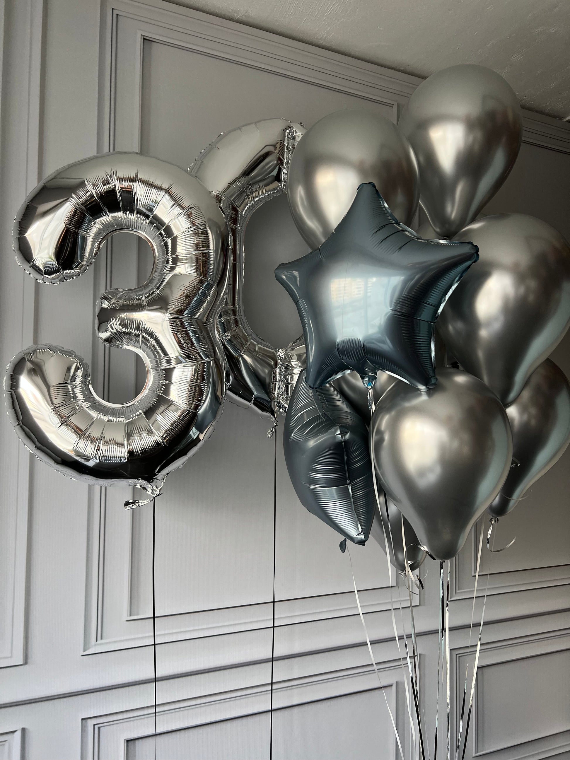 Mirror number balloon set with silver number balloon, star balloon, and chrome birthday decor in New York