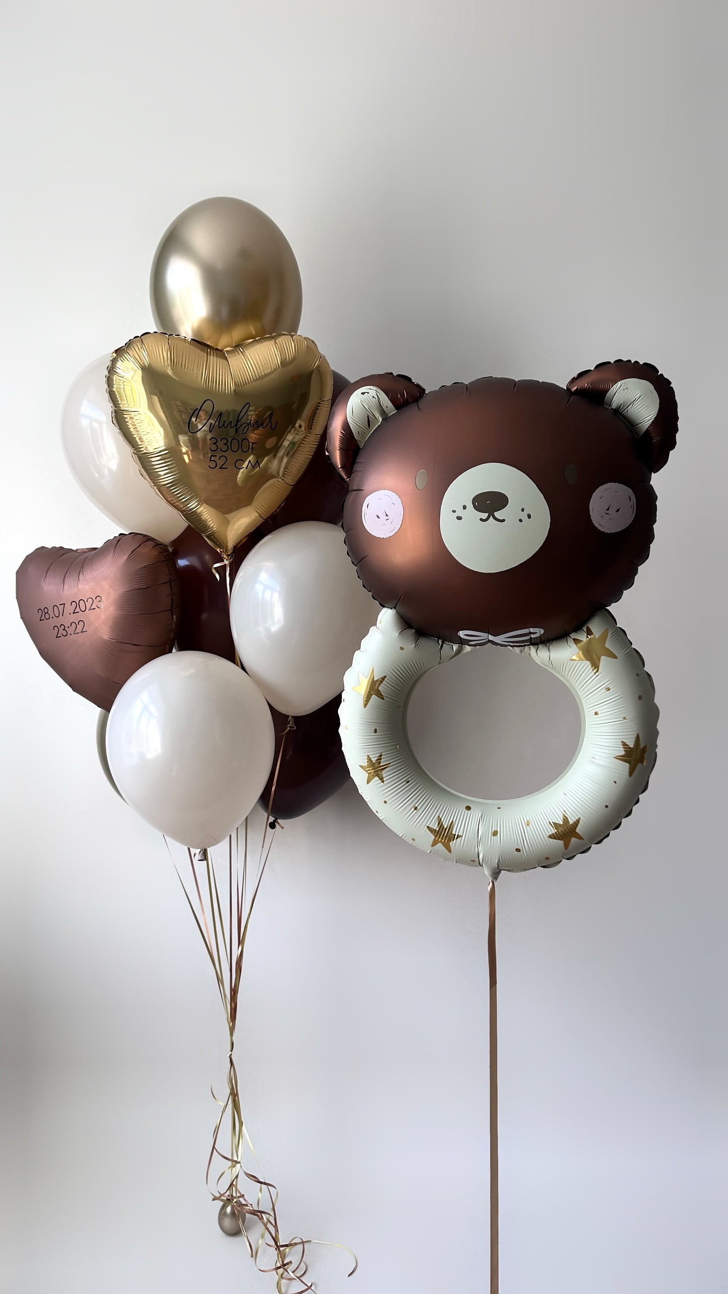 Oh baby balloon set with bear foil balloon, custom heart balloons, and neutral baby decor in New York