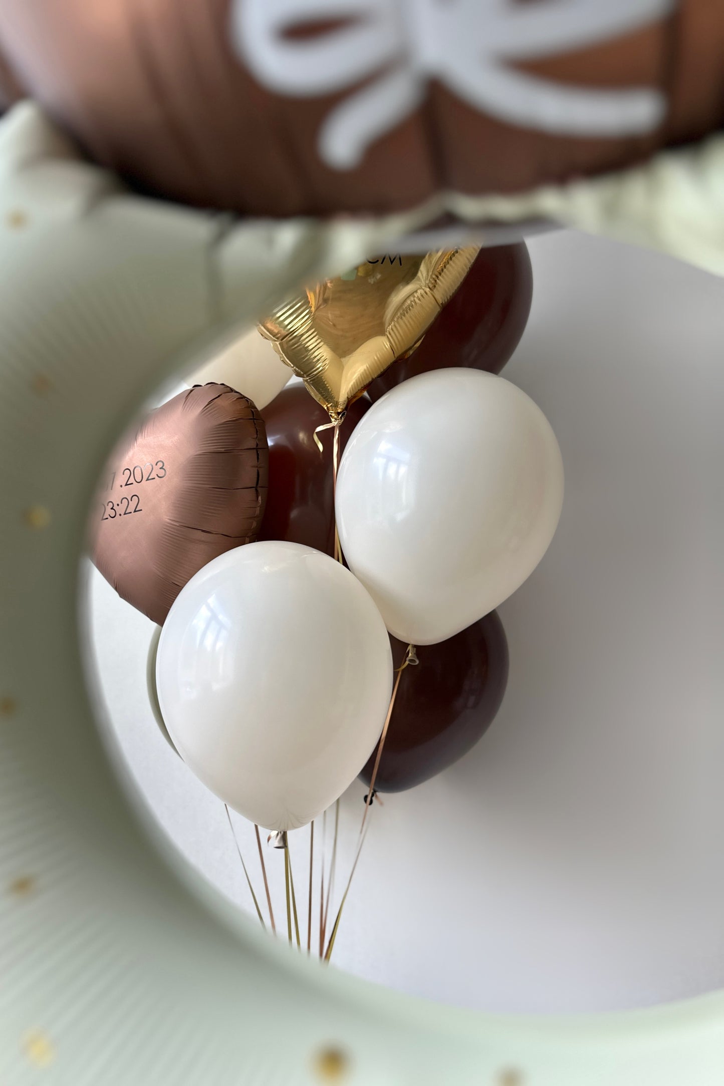 Neutral baby welcome balloon arrangement with custom heart balloons and latex balloons in Manhattan