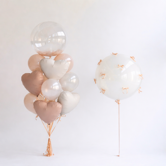 Peach Bow balloon set with bubble balloons, heart balloons, and feather detail for elegant celebration decor in New York