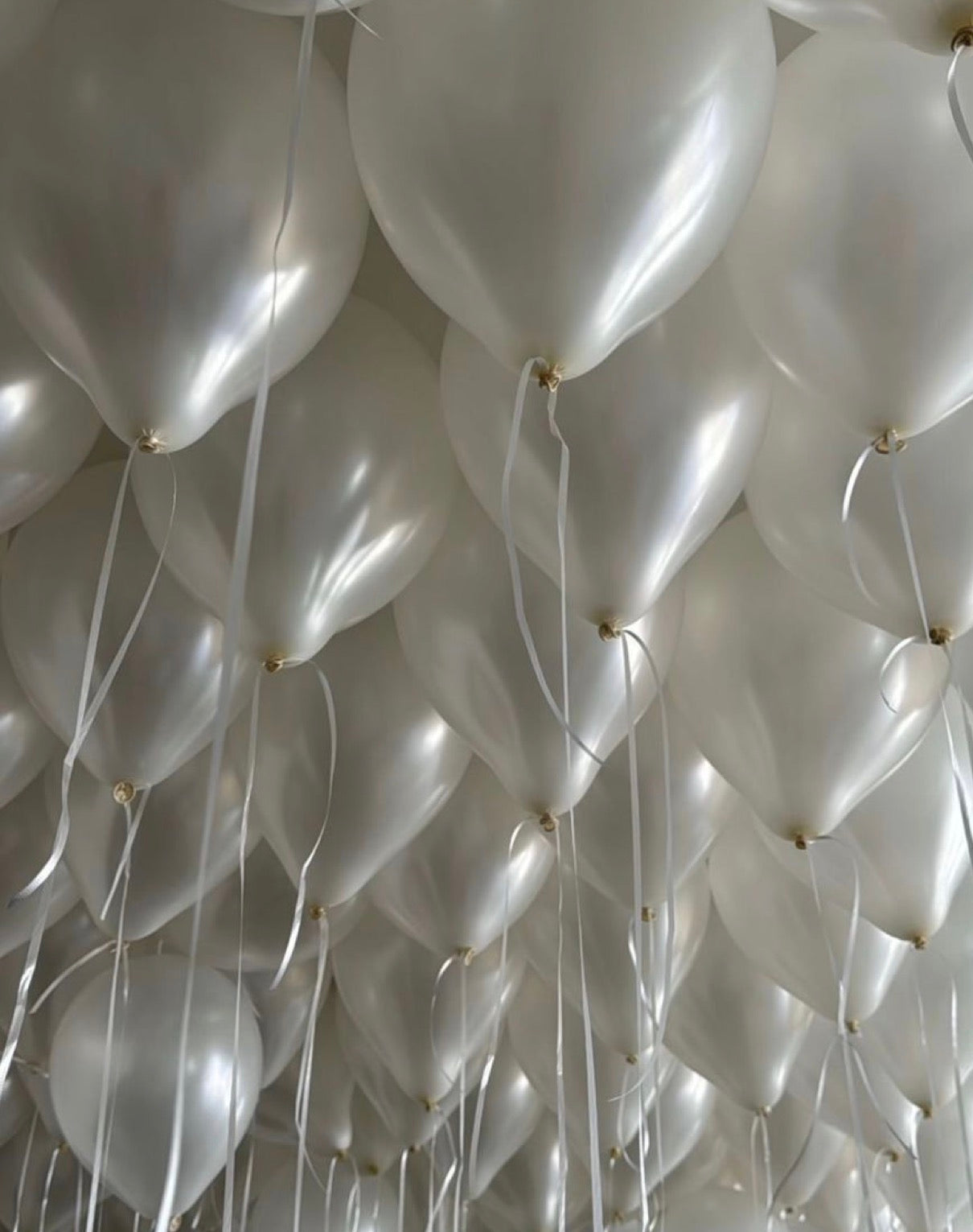 Pearl White Ceiling Balloons floating overhead for elegant event decor in New York