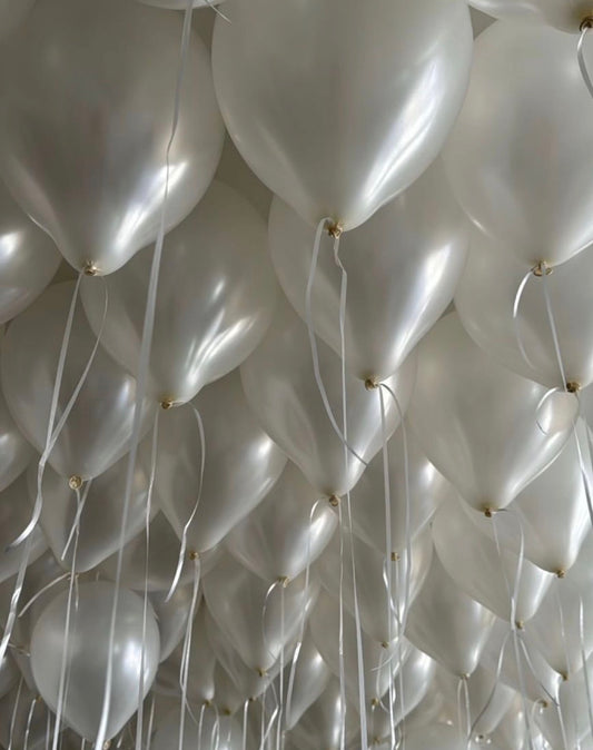 Pearl White Ceiling Balloons floating overhead for elegant event decor in New York