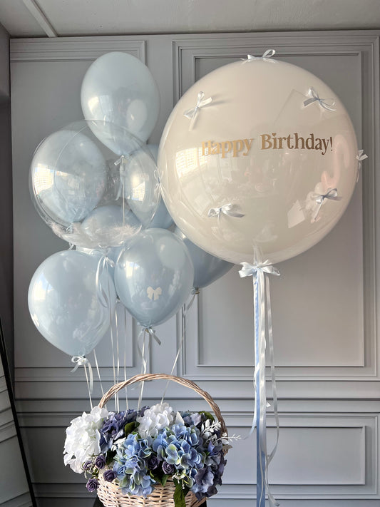 Popsicle birthday balloon set with custom sign bubble balloon, bows, and soft blue birthday decor in New York