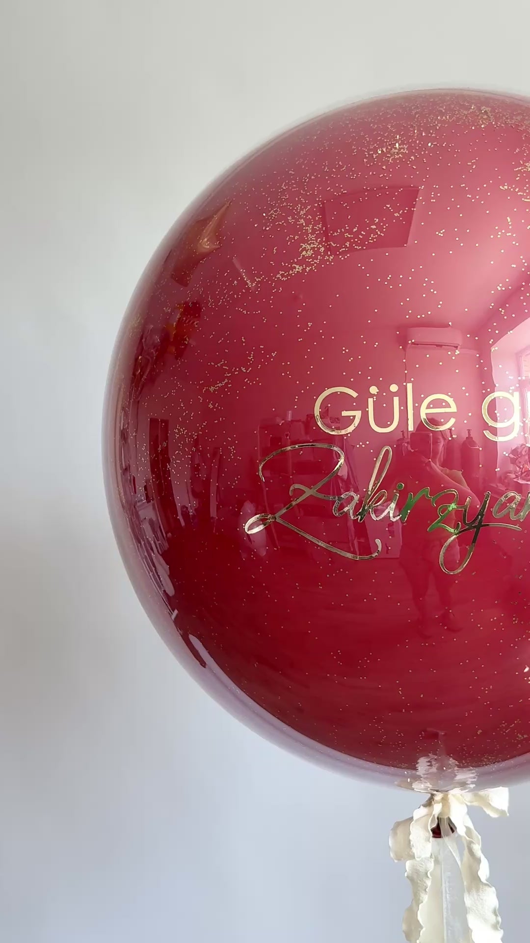 Video of burgundy bachelorette bubble balloon with custom sign for girls night decor in Brooklyn