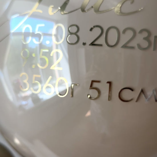 Close-up of personalized bubble balloon with baby birth details for elegant welcome baby decor in Manhattan