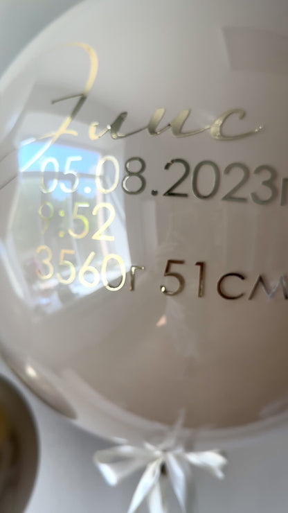 Close-up of personalized bubble balloon with baby birth details for elegant welcome baby decor in Manhattan