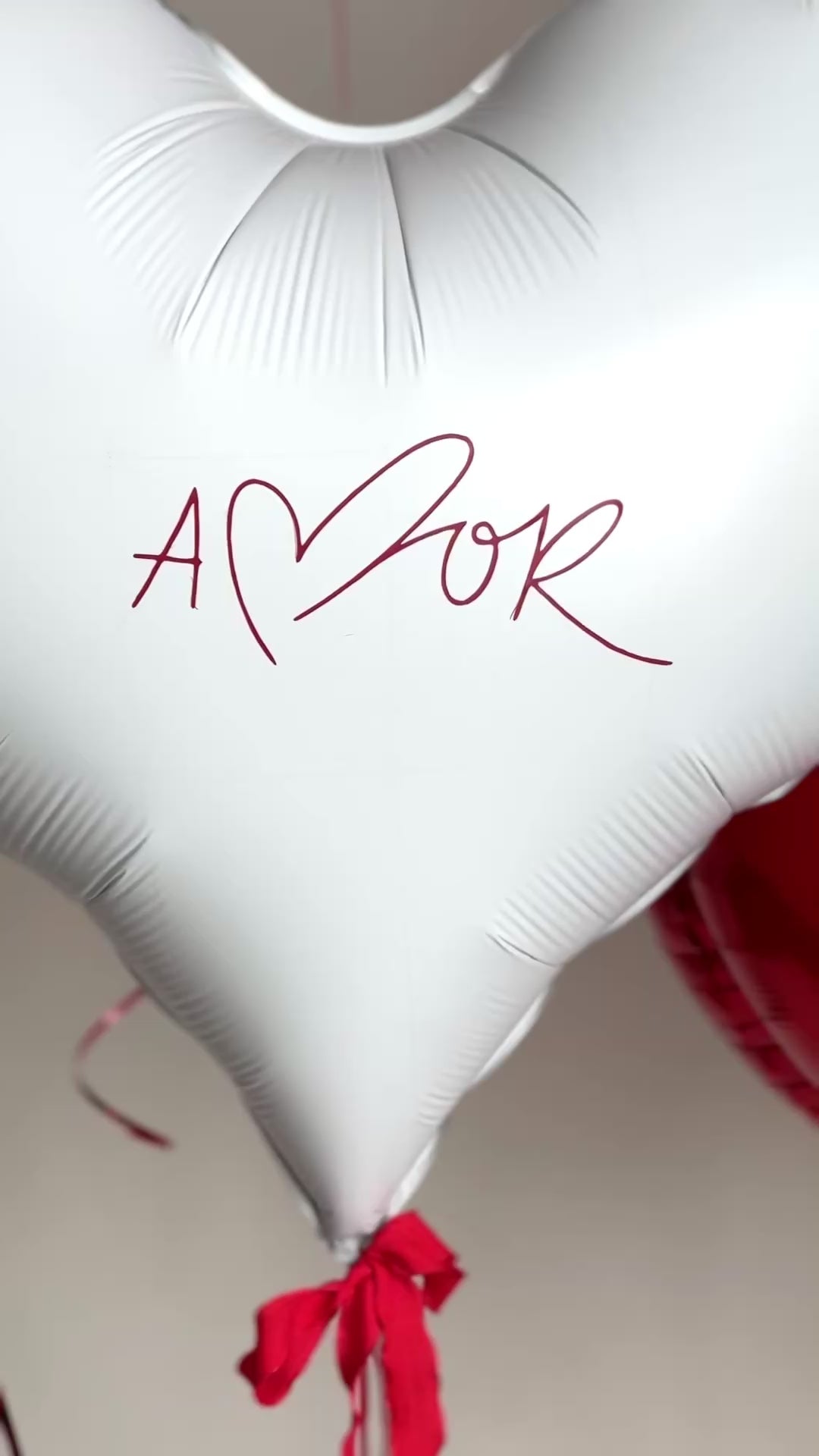 Video of heart balloon bouquet with personalized white heart balloon for romantic surprise decor in Brooklyn