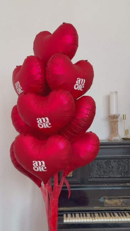 Close-up of red heart balloon bouquet for romantic celebration decor in New York