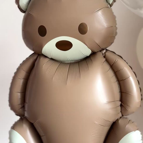Video of teddy bear balloon with caramel-toned balloons for baby celebration decor in NYC
