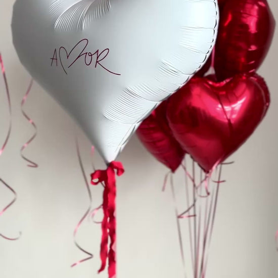 Video of red and white heart balloons arranged as a romantic bouquet in Manhattan