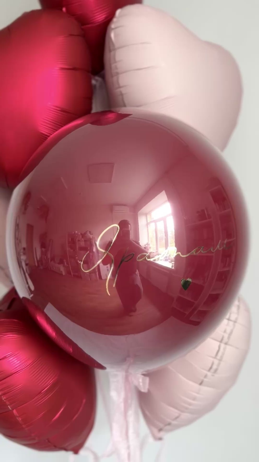 Video of romantic bubble balloon arrangement with red and blush heart balloons in Brooklyn