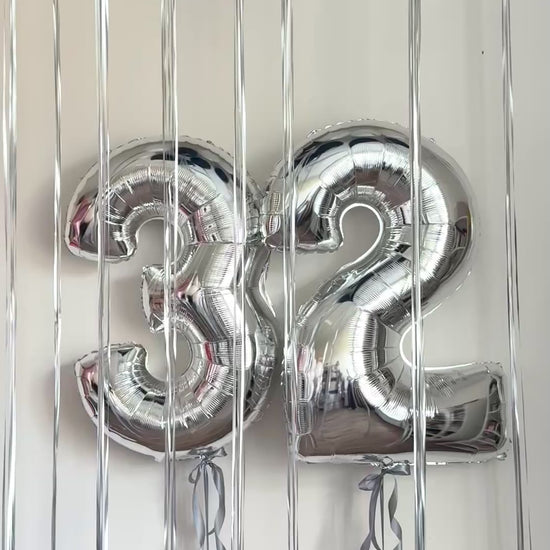 Video of metallic silver number balloon decor with floating ceiling balloons in Manhattan