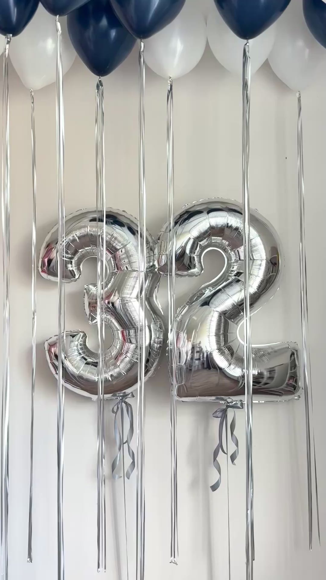 Video of metallic silver number balloon decor with floating ceiling balloons in Manhattan