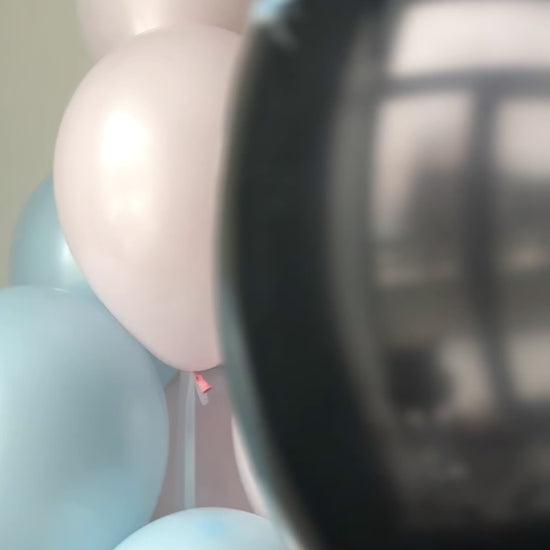 Close-up of Boy or Girl balloon for elegant gender reveal party decor in Manhattan