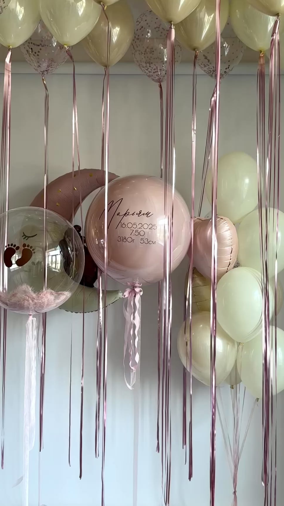 Video of baby blossom balloon decor with pastel ceiling balloons and custom bubble balloon in Brooklyn