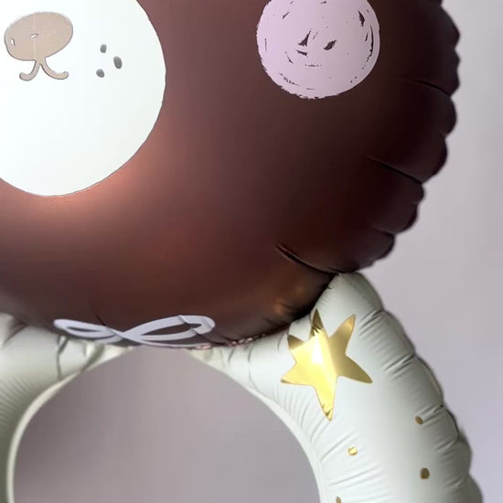 Video of teddy bear foil balloon and baby celebration setup in Queens