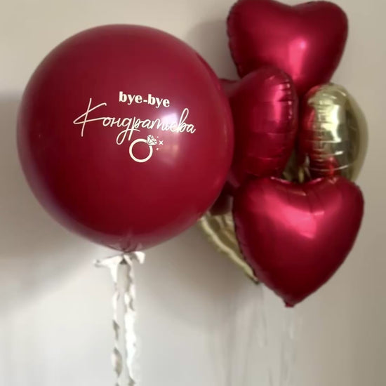 Video of red balloon arrangement with personalized sign balloon and heart balloons in NYC