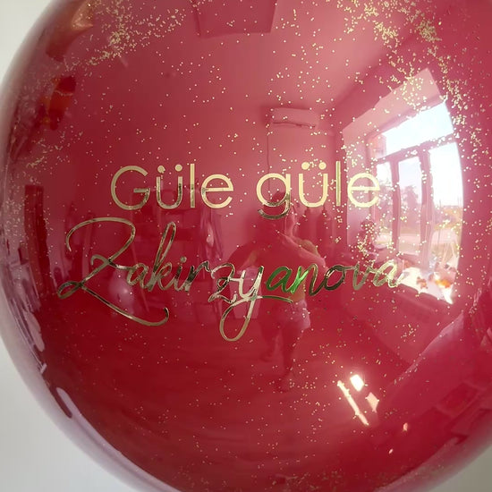 Video of personalized bachelorette bubble balloon with glossy burgundy finish in Manhattan