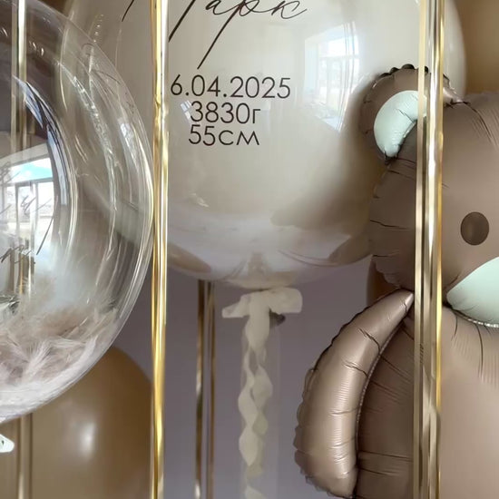 Detail of custom sign bubble balloons with teddy bear balloon for newborn celebration decor in Manhattan