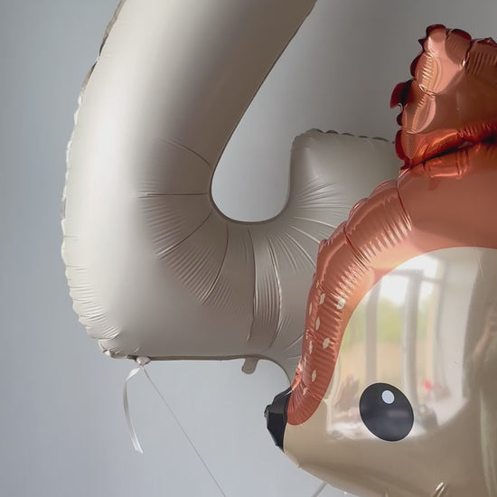 Close-up of woodland deer balloon with number balloon for first birthday party decor in Brooklyn