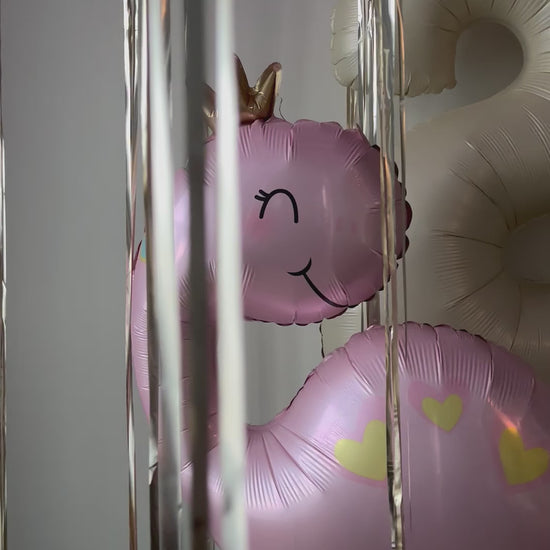 Video of dinosaur balloon and pink birthday setup for girls party decor in Queens