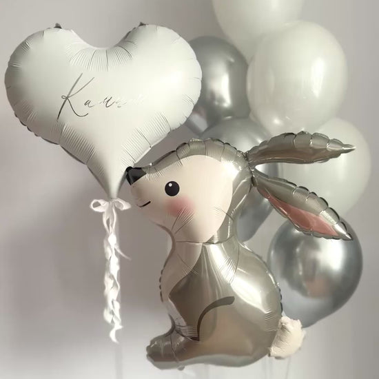 White and silver bunny balloon set with white latex balloons and custom heart balloon for event decor in NYC
