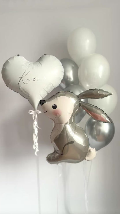 White and silver bunny balloon set with white latex balloons and custom heart balloon for event decor in NYC