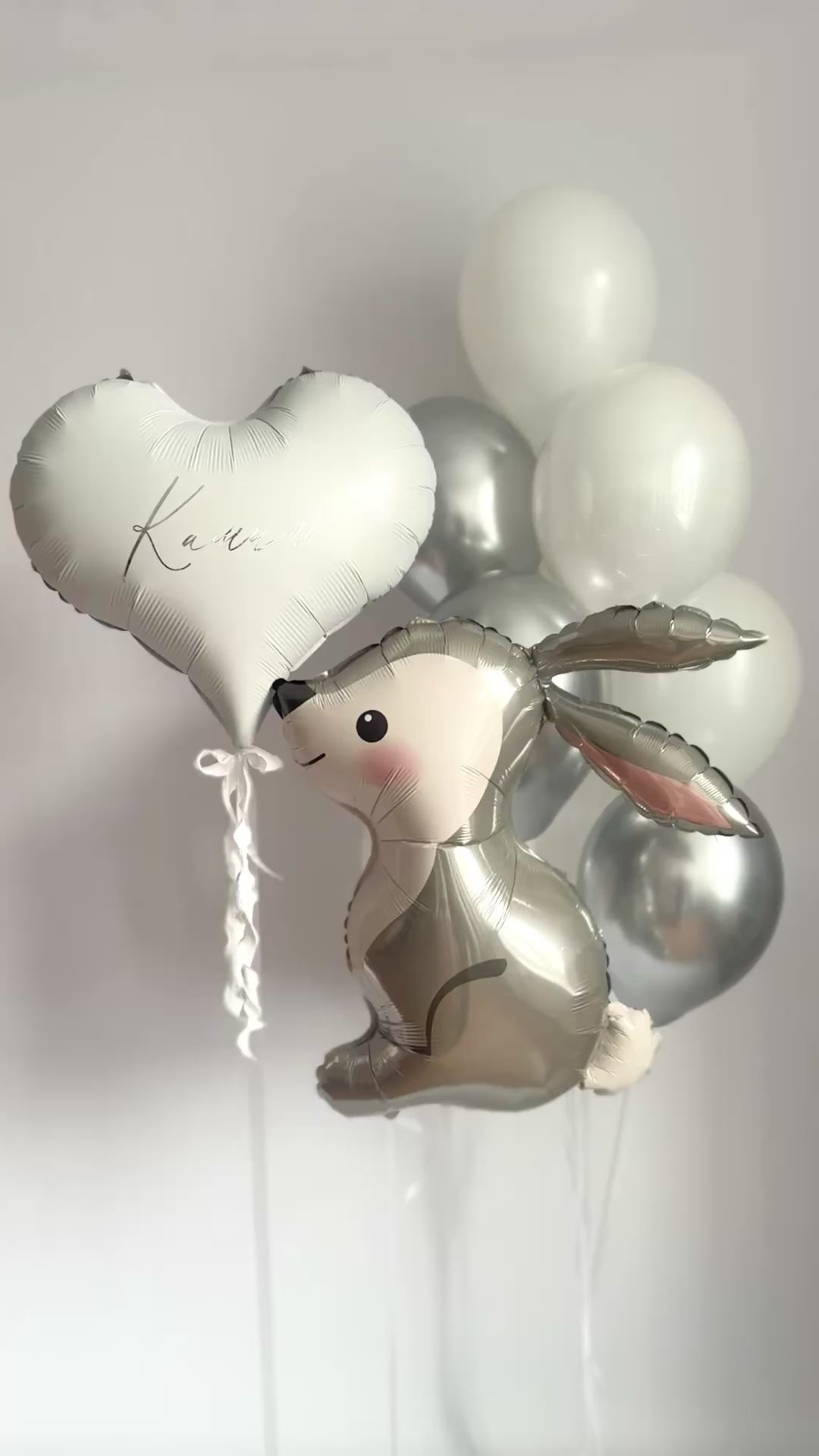 White and silver bunny balloon set with white latex balloons and custom heart balloon for event decor in NYC