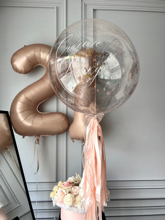 Shine balloon set with glitter bubble balloon, bronze number balloons, and elegant birthday decor in New York