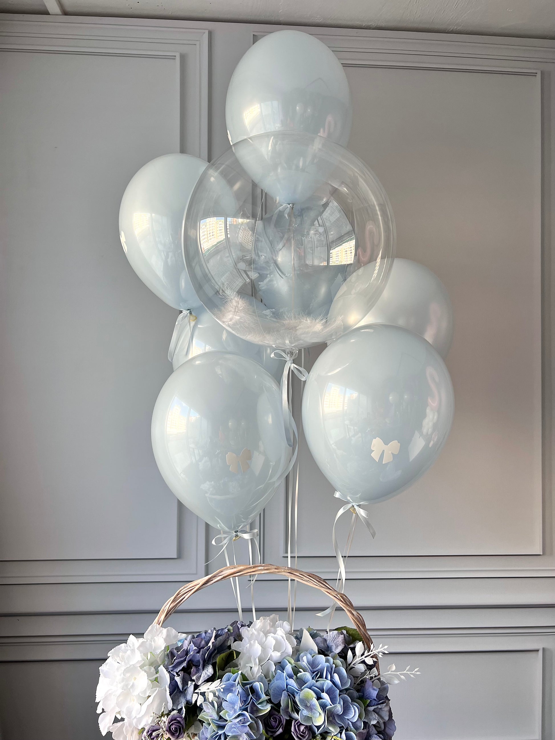 Sky glass balloon set with blue glass balloons and feather bubble balloon for elegant celebration decor in New York