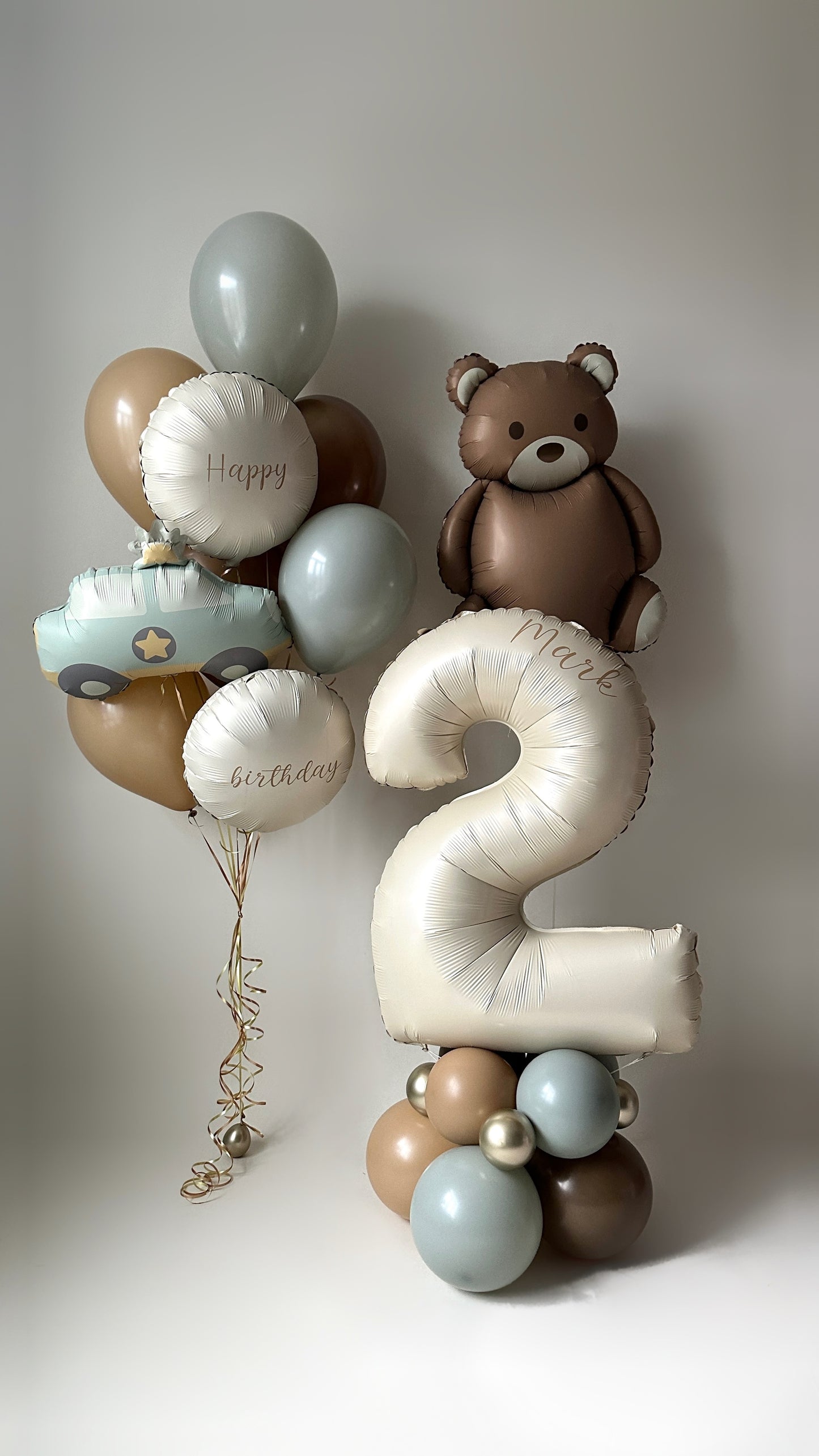 Soft touch balloon set with number balloon stand, teddy bear balloon, and neutral kids party decor in New York