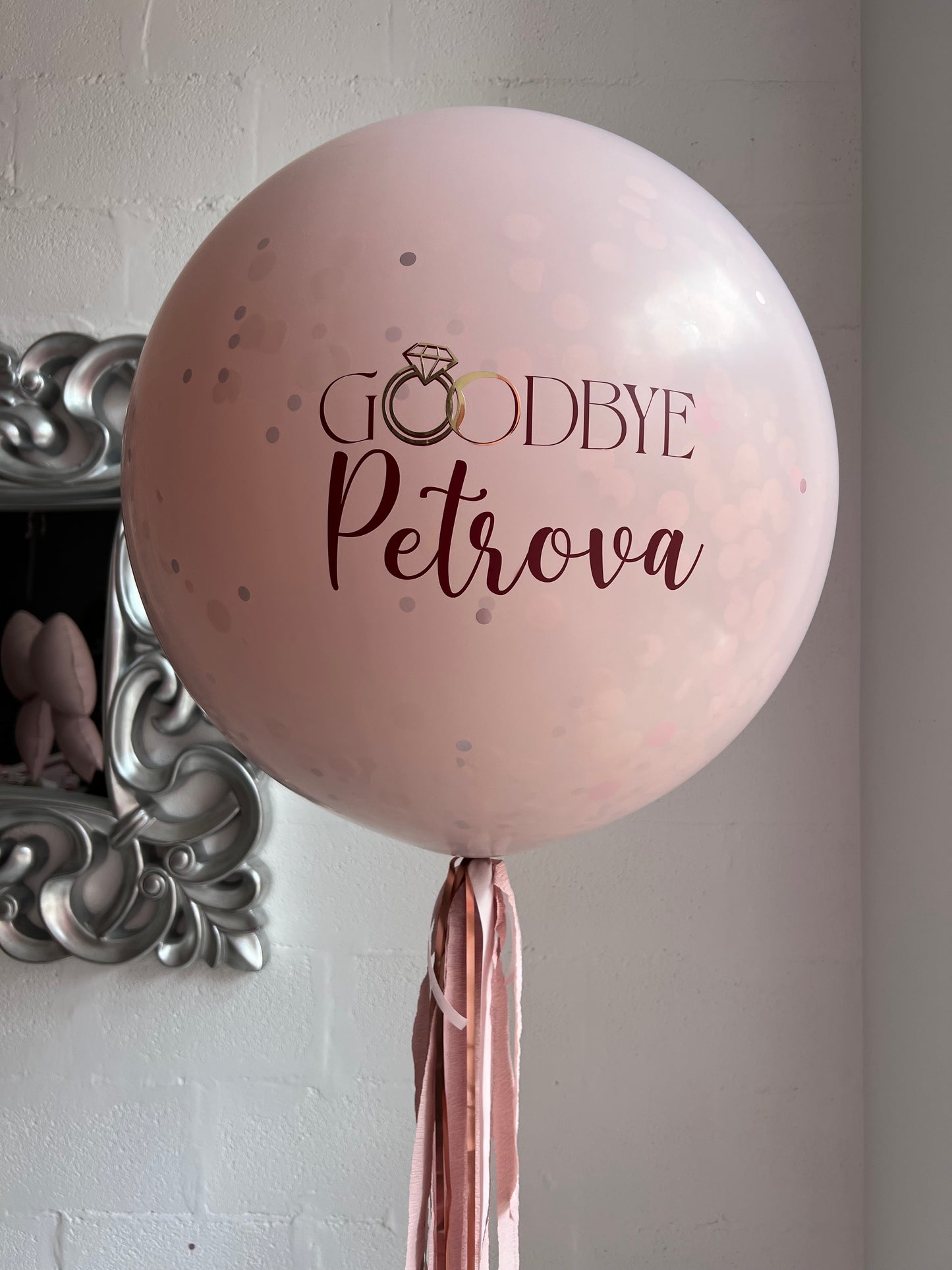 Surprise balloon with custom sign and heart inside for bachelorette party decor in New York