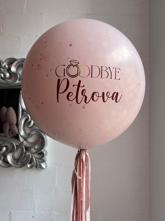 Surprise balloon with custom sign and heart inside for bachelorette party decor in New York