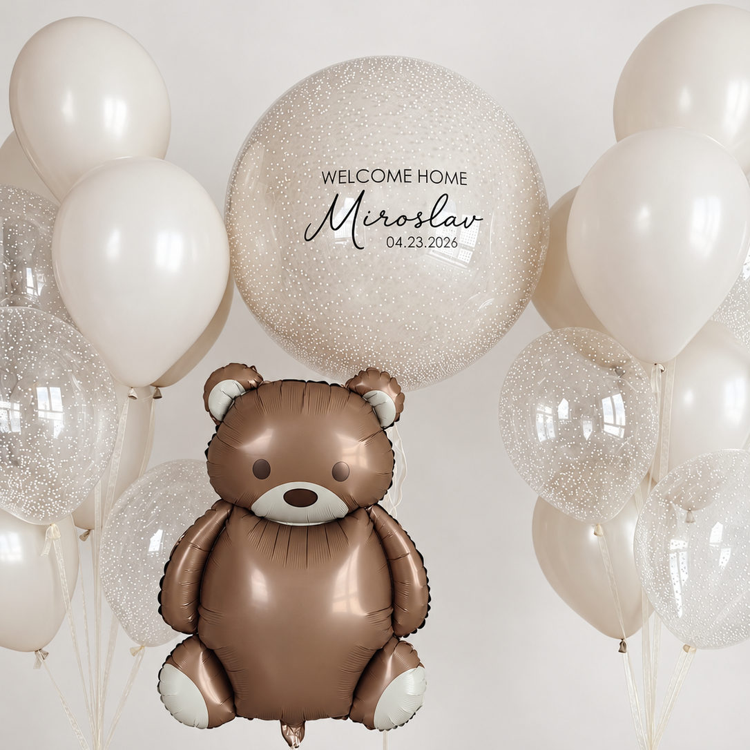 Brown teddy bear balloon with a personalized foam bead bubble balloon and two bunches of ivory and clear balloons filled with white foam beads.